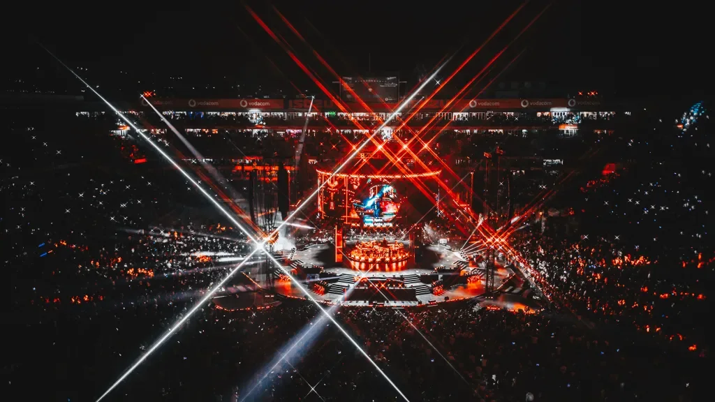 Scorpion Kings Live stadium production with red laser beams and a large central stage